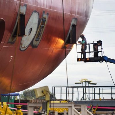 worker-repairing-container-ship-at-industry-2022-05-26-04-12-37-utc-scaled-ppsa46ewot5m4h5lwx9450c8n5p4tg51vjwlvih27k